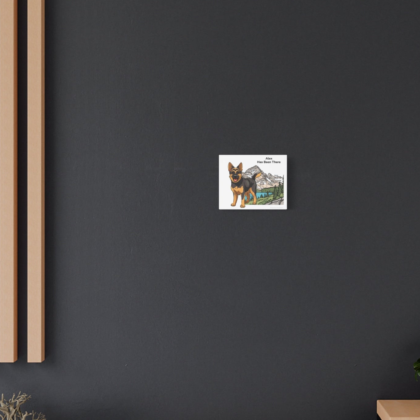 Personalized matte canvas art with a dog illustration, dog name, "Has Been There" badge, and Glacier national park illustration, hung on a dark wall, far shot. National Park Series.