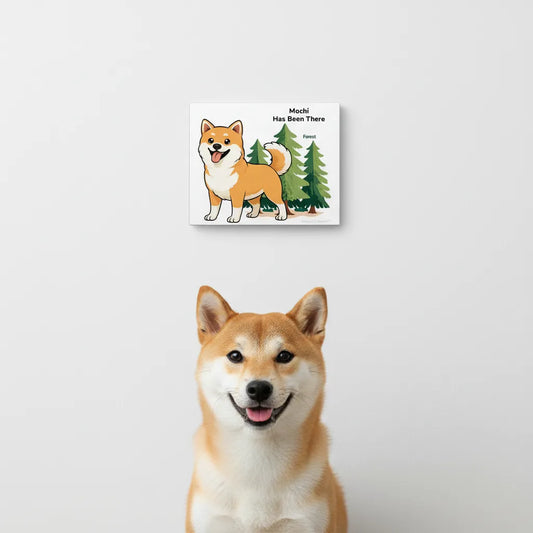 Personalized matte canvas art with a dog illustration, dog name, "Has Been There" badge, and forest illustration, and a Shiba Inu dog is sitting in front of it. Outdoor Adventure Series.