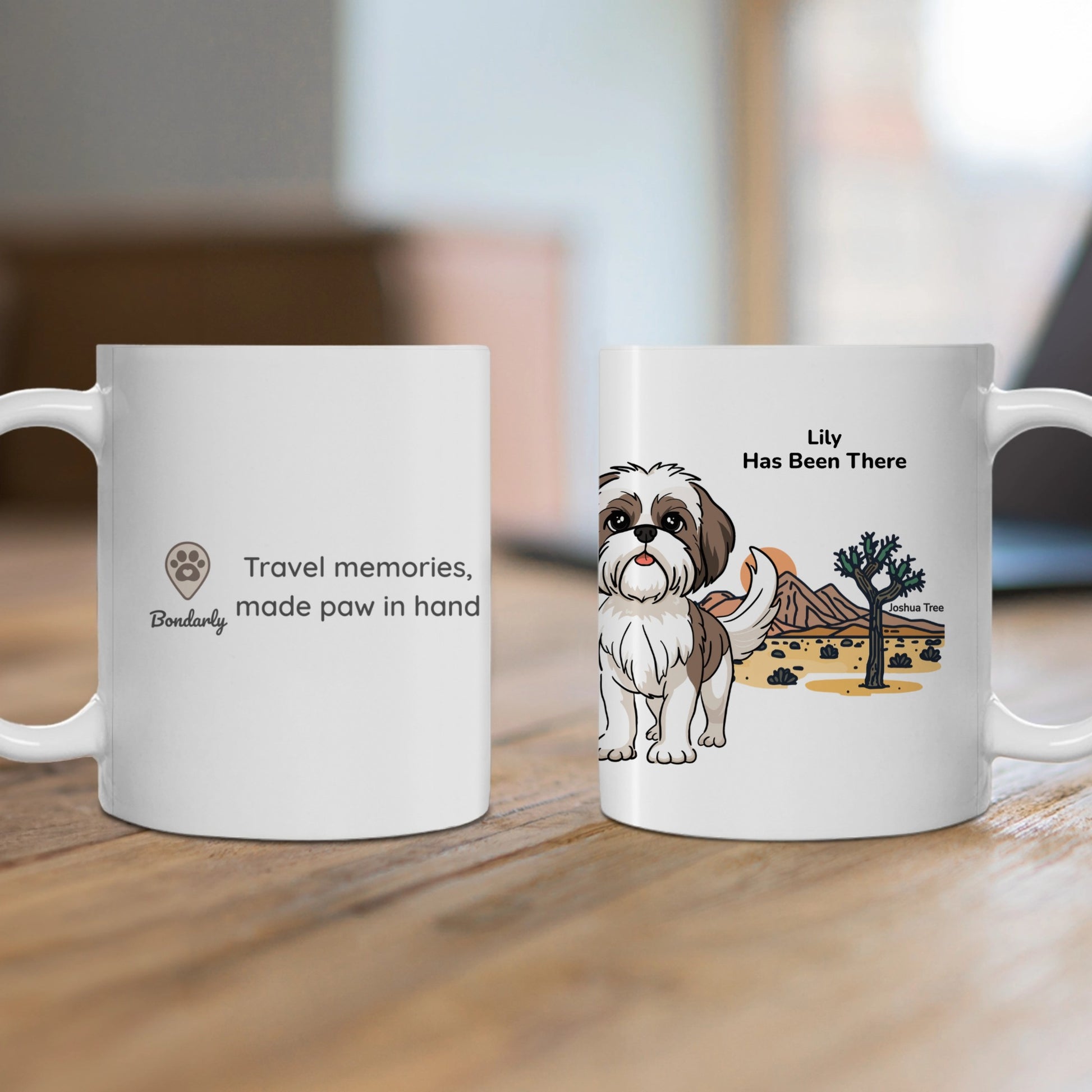 A personalized mug, right hand side with a dog illustration, dog name, "Has Been There" badge, and Joshua Tree national park illustration, and the left hand side with Bondarly's logo and slogan. National Park Series.