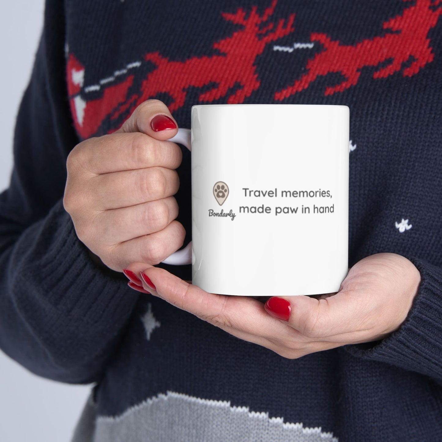 Hand holding a personalized mug from the left side showing Bondarly's logo and slogan.